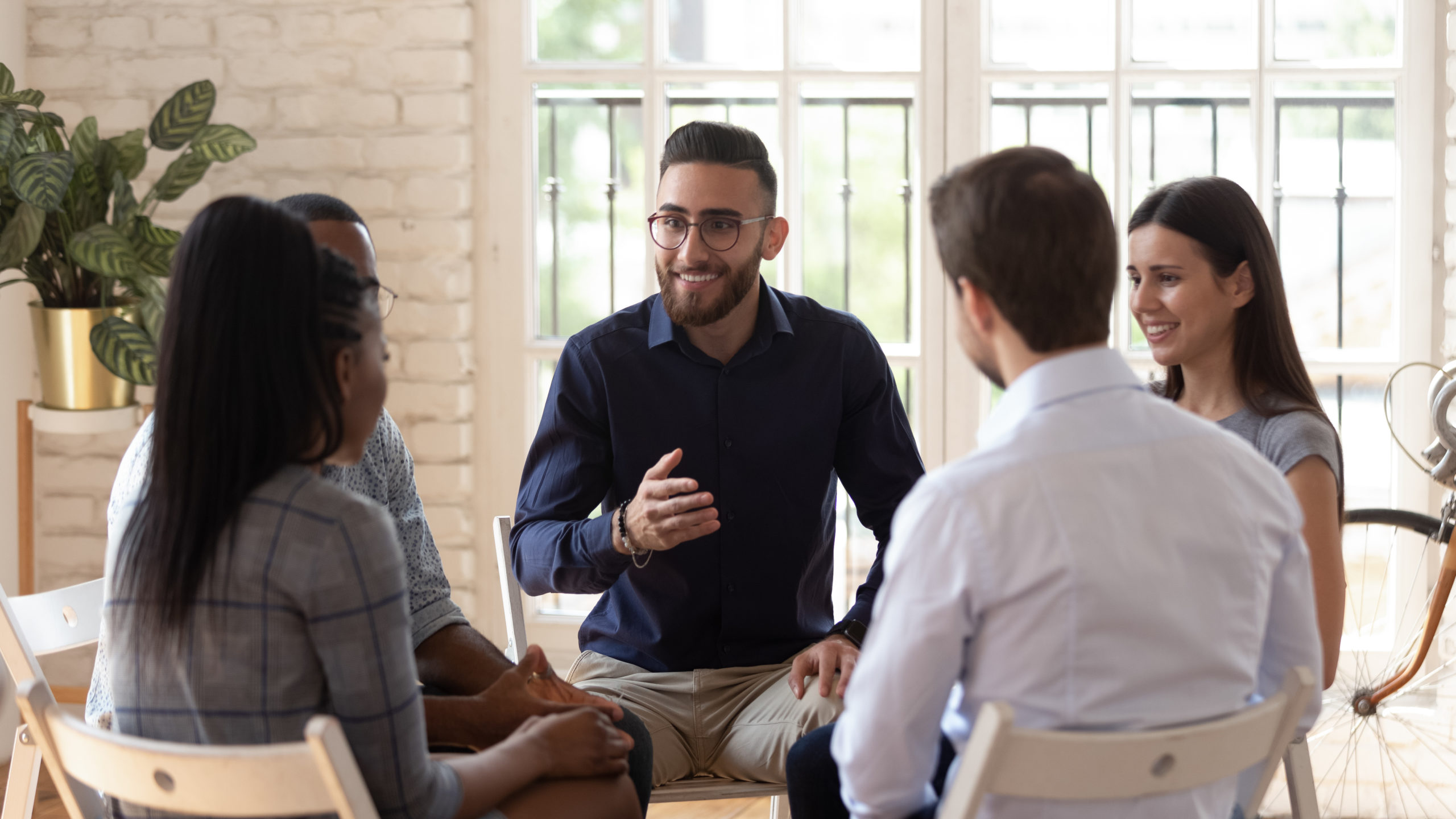 Diverse people speak share problems at therapy session